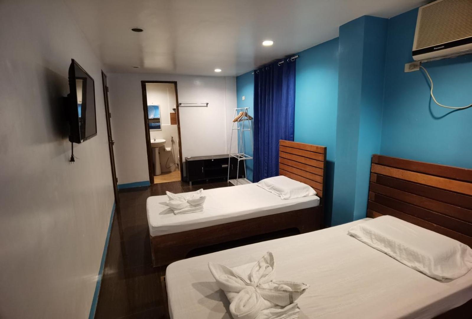 Amos Pili Tree Inn Powered By Cocotel Эль-Нидо Номер фото